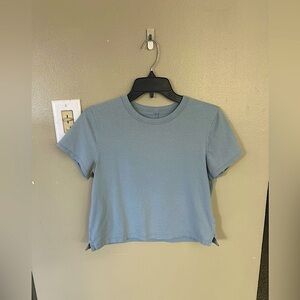Lululemon Women’s Steel Blue Tee. Size is between a 4-6.